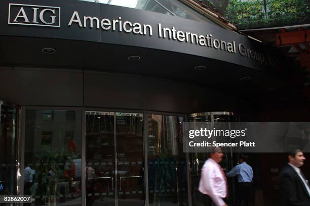 Pedestrians walk in front of a American International Group, Inc. Building September 17, 2008 in New York City. The Federal Reserve rescued American...