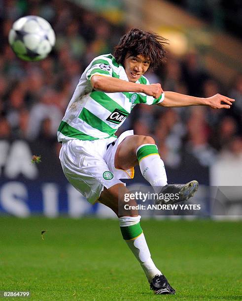 Celtic's Japanese midfielder Shunsuke Nakamura shoots a free kick at the Aalborg goal during the Uefa Champions League group E football match at...