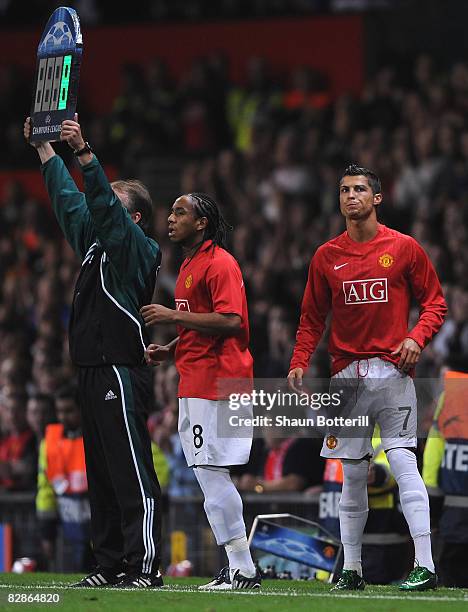 Cristiano Ronaldo of Manchester United and team mate Anderson prepare to come on as substitutes during the UEFA Champions League Group E match...