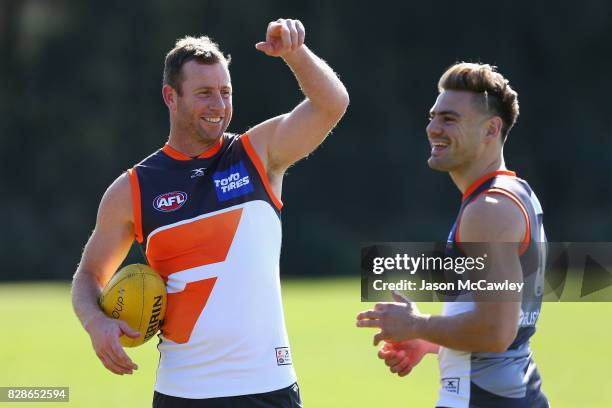 Steve Johnson of the Giants speaks to Stephen Coniglio of the Giants during a Greater Western Sydney Giants AFL training session at Sydney Olympic...