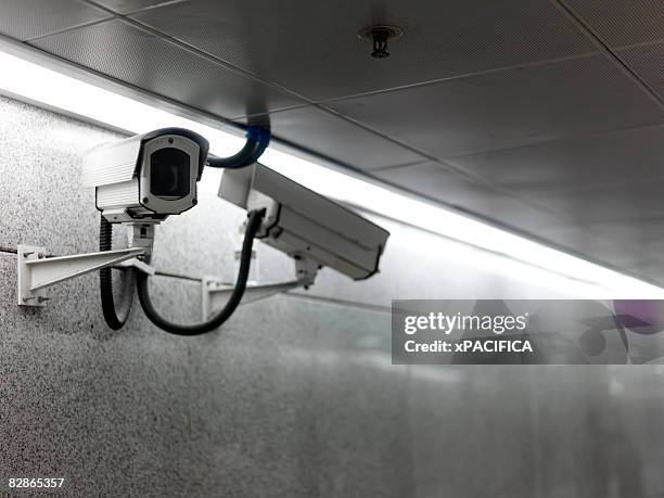 video cameras monitoring the underground pedestria - surveillance fotografías e imágenes de stock