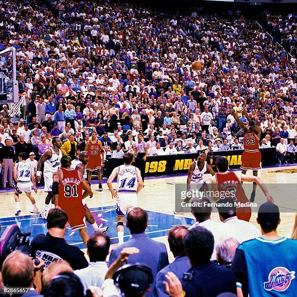 Michael Jordan of the Chicago Bulls hits the game winning shot against the Utah Jazz during Game Six of the 1998 NBA Finals played June 14, 1998 at...