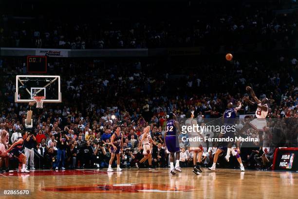 Michael Jordan of the Chicago Bulls shoots a last second shot against the Utah Jazz in Game Five of the 1998 NBA Finals at the United Center on June...