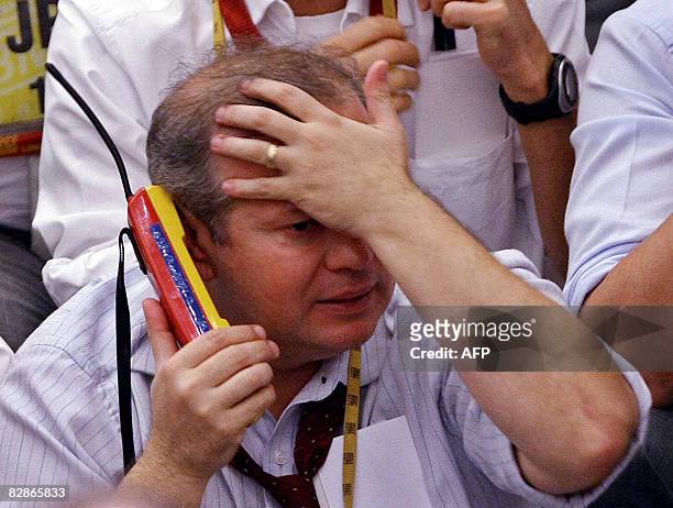 Brazilian trader looks upset as he negotiates during the afternoon session at the Mercantile & Futures Exchange , in Sao Paulo, Brazil, on September...