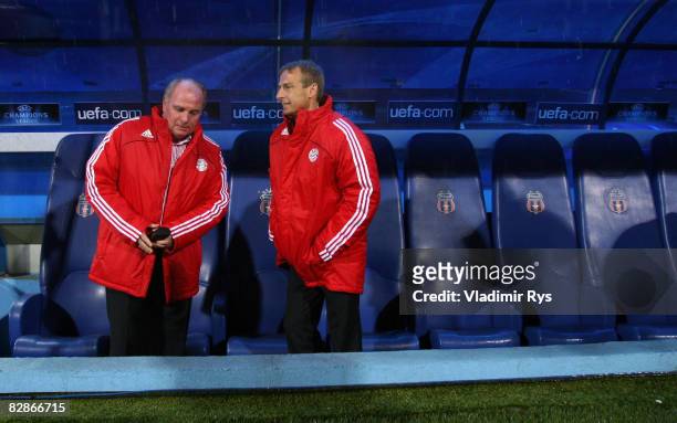 Manager Ulli Hoeness and coach Juergen Klinsmann of Bayern look on prior to the UEFA Champions League Group F match between FC Steaua Bucuresti and...