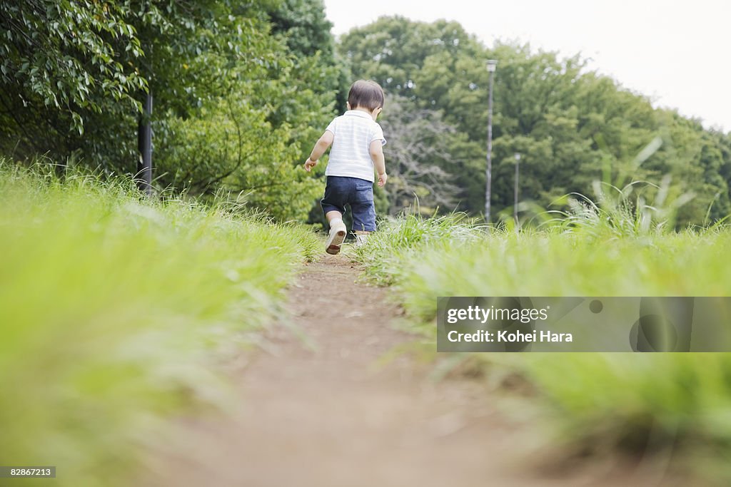 Baby walking on path