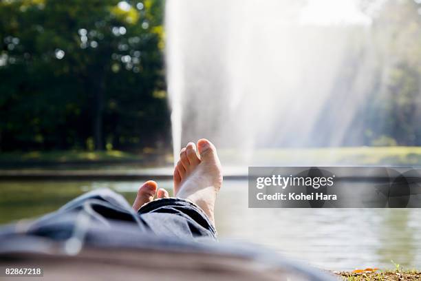 man getting relaxed in the park - wonderlust2015 stock pictures, royalty-free photos & images