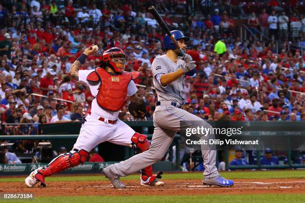 Yadier Molina of the St. Louis Cardinals throws to second base as Eric Hosmer of the Kansas City Royals bats in the second inning at Busch Stadium on...