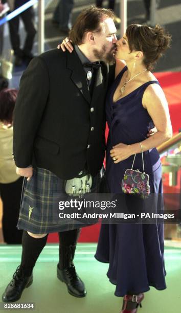 Actor Brian Cox and his wife Nicole Ansari-Cox arriving for the X-Men 2 charity film premier at the Warner Village Cinema complex in Edinburgh.