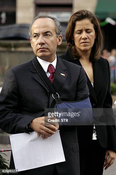 Mexican President Felipe Calderon and his wife Margarita Zavala visit the site of deadly attacks in Morelia on September 17, 2008. Mexico on...
