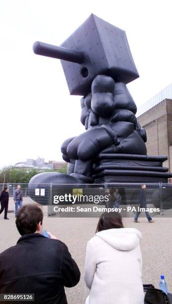 The towering 115ft inflatable sculpture, Blockhead based on the puppet-boy Pinocchio outside outside London's Tate Modern gallery, where it is due to...