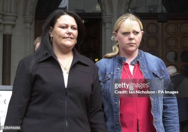 Sharon Richardson, left, and Linda Brown, the sisters of Martin Brown, one of the victims of child killer Mary Bell, leave the High Court in London,...