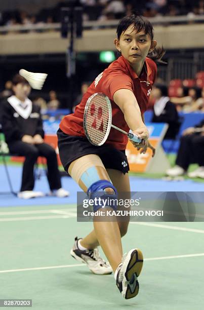 Indonesia's Maria Kristin Yulianti returns the shuttlecock against Wong Mew Choo of Malaysia during their women's singles 2nd round match at the...