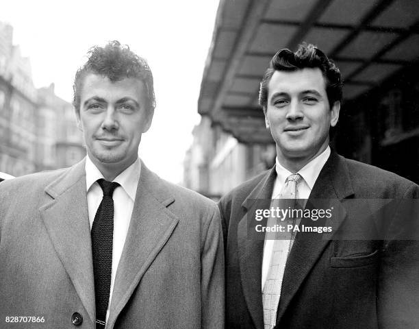 British film star Maxwell Reed and American film star Rock Hudson leaving their London hotel for Jersey, where they go on location for filming...