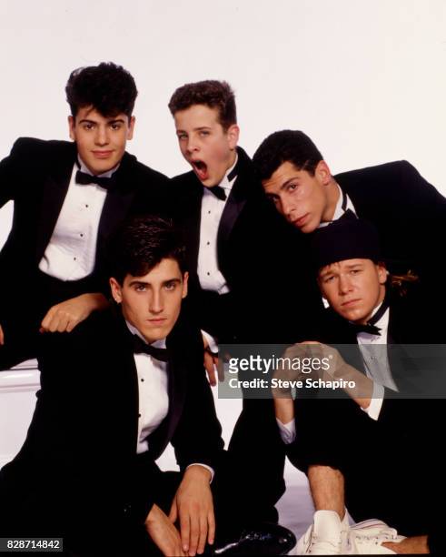 Portrait of American pop group New Kids on the Block posed against a white background, Los Angeles, California, 1989. Pictured are, from left, Jordan...