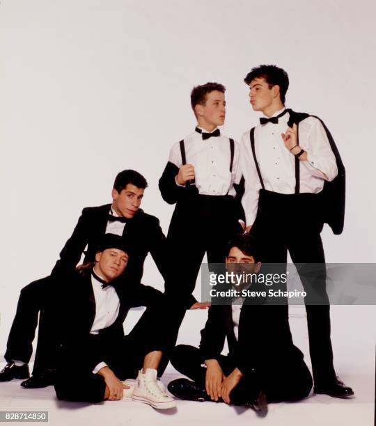 Portrait of American pop group New Kids on the Block posed against a white background, Los Angeles, California, 1989. Pictured are, from left, Donnie...