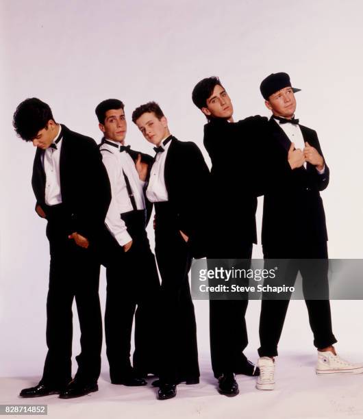 Portrait of American pop group New Kids on the Block posed against a white background, Los Angeles, California, 1989. Pictured are, from left, Jordan...