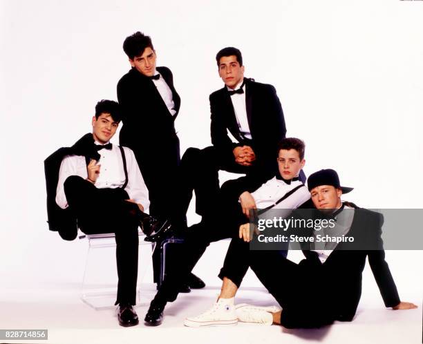 Portrait of American pop group New Kids on the Block posed against a white background, Los Angeles, California, 1989. Pictured are, from left, Jordan...