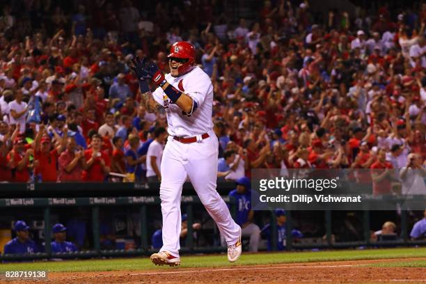 Yadier Molina of the St. Louis Cardinals celebrates after hitting a grand slam against the Kansas City Royals in the sixth inning at Busch Stadium on...