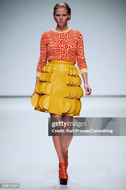 Model walks the runway wearing the Christopher Kane Spring/Summer 2008/2009 collection during London Fashion Week on September 16, 2008 in London,...