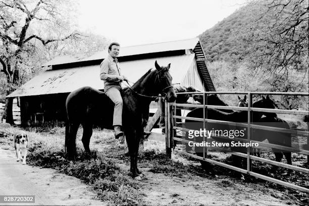 View of Canadian actor William Shatner as he rides a horse at his ranch, Three Rivers, California, 1982.