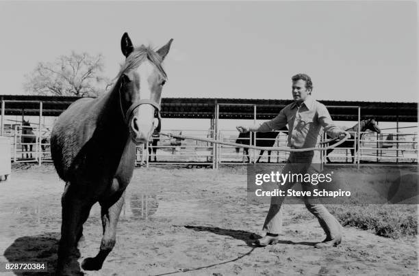 Canadian actor William Shatner trains a horse to circle at his ranch, Three Rivers, California, 1982.