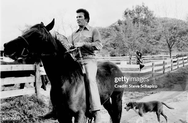 View of Canadian actor William Shatner as he rides a horse at his ranch, Three Rivers, California, 1982.