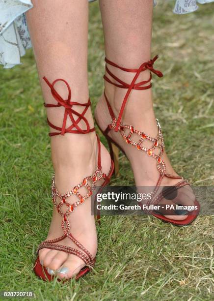 Laura Rumble models shoes worth 1 million, made with 800 rubies,for the ladies day meeting at Royal Ascot.