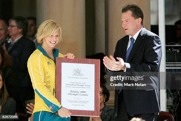 Libby Trickett is presented with a plaque by NSW Premier Nathan Rees during a welcome home parade for the Beijing 2008 Olympic Athletes on George...