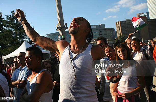 Reveler screams, "Viva Mexico" at a celebration marking Mexican Independence Day September 14, 2008 in Denver, Colorado. Both the Democratic and...