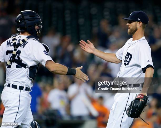 James McCann of the Detroit Tigers celebrates with Shane Greene of the Detroit Tigers after a 10-0 win over the Pittsburgh Pirates in an interleague...