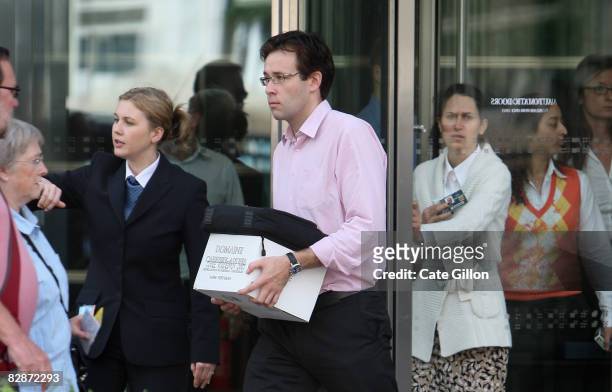 Man leaves Lehman Brothers' Canary Wharf office on September 15, 2008 in London, England. The fourth largest American investment bank has announced...