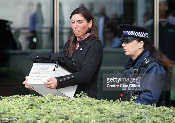 Woman leaves Lehman Brothers' Canary Wharf office carrying belongings on September 15, 2008 in London, England. The fourth largest American...