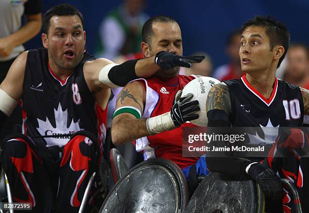 Mike Whitehead of Canada grabs the ball from Troye Collins of Great Britain during the Wheelchair Rugby match between Great Britain and Canada at the...