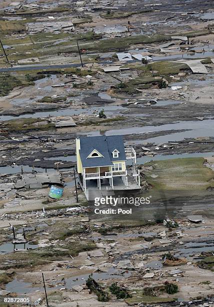 Home is left standing among debris from Hurricane Ike September 14, 2008 in Gilchrist, Texas. Floodwaters from Hurricane Ike are reportedly as high...