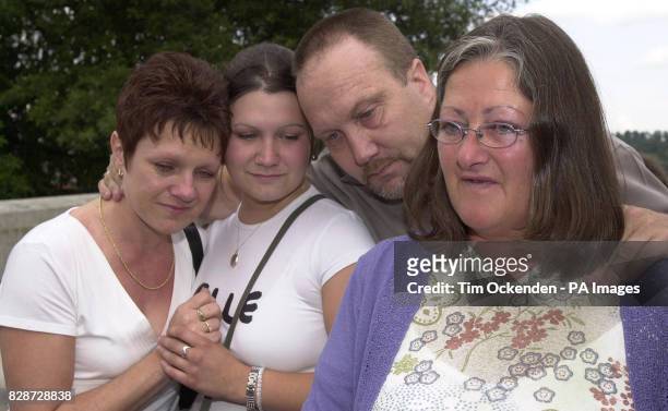 The family of murder victim Tristian Lovelock make a statement outside Winchester Crown Court, after accounts clerk Richard Markham was jailed for...