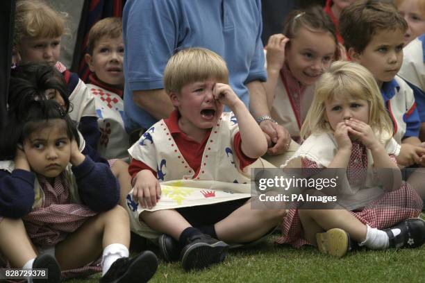 Henry, a three-year-old pupil at the Eagle House School nursery in Sandhurst, Berkshire, cries 'I don't like Prince Charles' as the Prince of Wales...