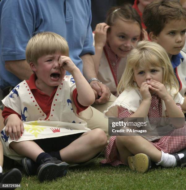 Henry, a three-year-old pupil at the Eagle House School nursery in Sandhurst, Berkshire, cries 'I don't like Prince Charles' as the Prince of Wales...