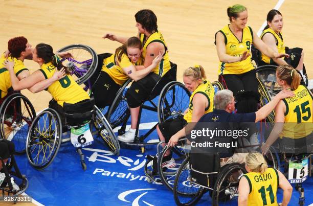 Australian players celebrate winningthe bronze medal Wheelchair Basketball match between Australia and Japan at the National Indoor Stadium during...