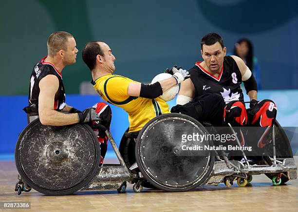 Fabien Lavoie of Canada slams his wheelchair in to Bryce Alman of Australia as they compete in the Wheelchair Rugby match between Australia and...