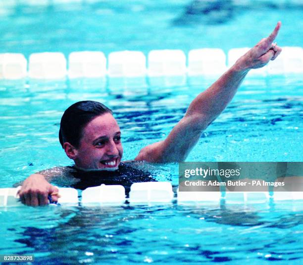 England's Karen Pickering celebrates after her victory in the 100m freestyle at the Commonwealth Games in Canada.