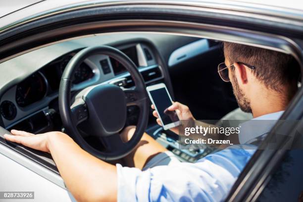 paying parking fee with new mobile app - application fee stock pictures, royalty-free photos & images