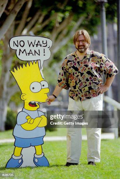 Cartoonist and creator of "The Simpsons" stands 1992, with a cardboard cutout of Bart Simpson.