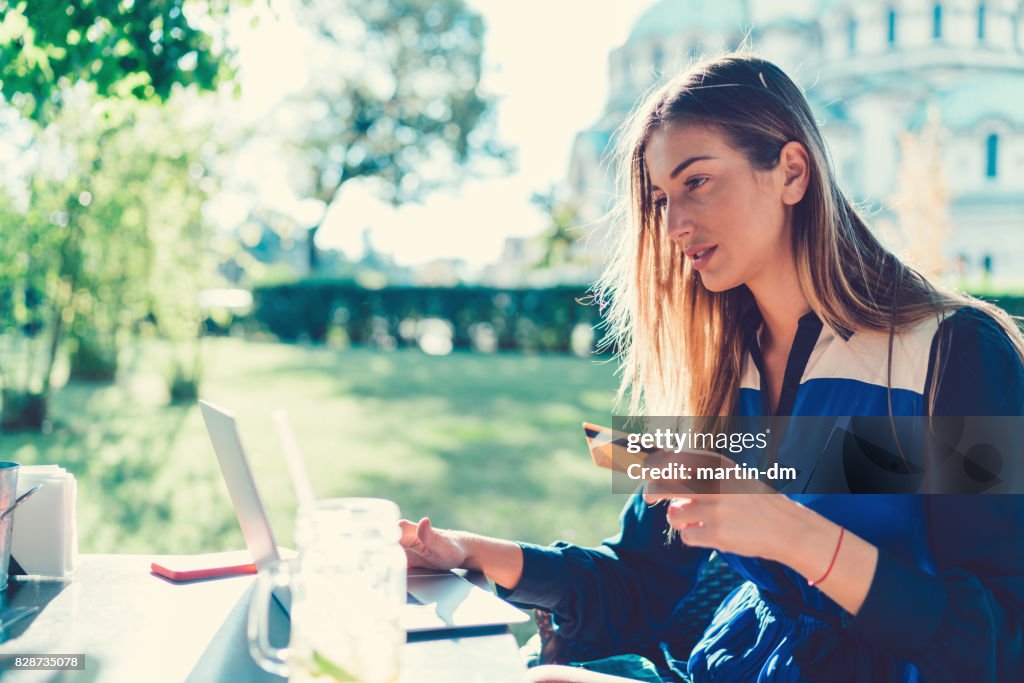 Woman shopping online with credit card