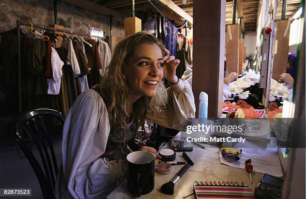 Members of Cambridge University's Gilbert and Sullivan Society get ready backstage as they perform 'The Yeomen Of The Guard' at the Minack Theatre's...