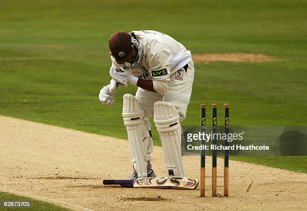 Shoaib Akhtar of Surrey kneels on the wicket after being hit by a delivery from Andre Adams of Nottinghamshire during the second day of the LV County...