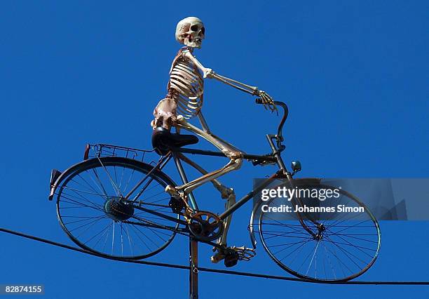 Skeleton with a bicycle is seen on top of ghost train 'Schocker' during a preview tour two days ahead of the opening of the Oktoberfest on September...