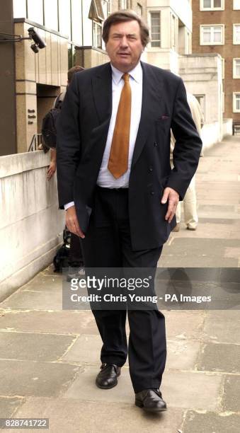 Monsieur Serge Kubla, the Minister Economy for the Waloon District in Belgium, leaves the offices of Formula One Management Limited after a meeting...