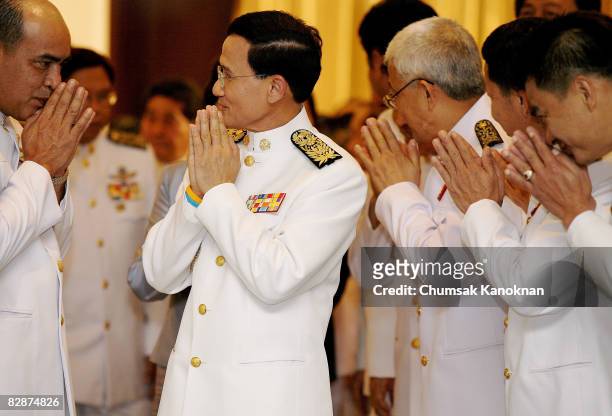Somchai Wongsawat give traditional greetings to members of his party after receiving the official royal command which appoints him as Thailand's new...
