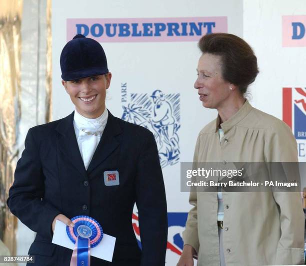 Zara Phillips collects her prize from her mother the Princess Royal after finishing in fourth place on Toytown in the Advanced section of the...